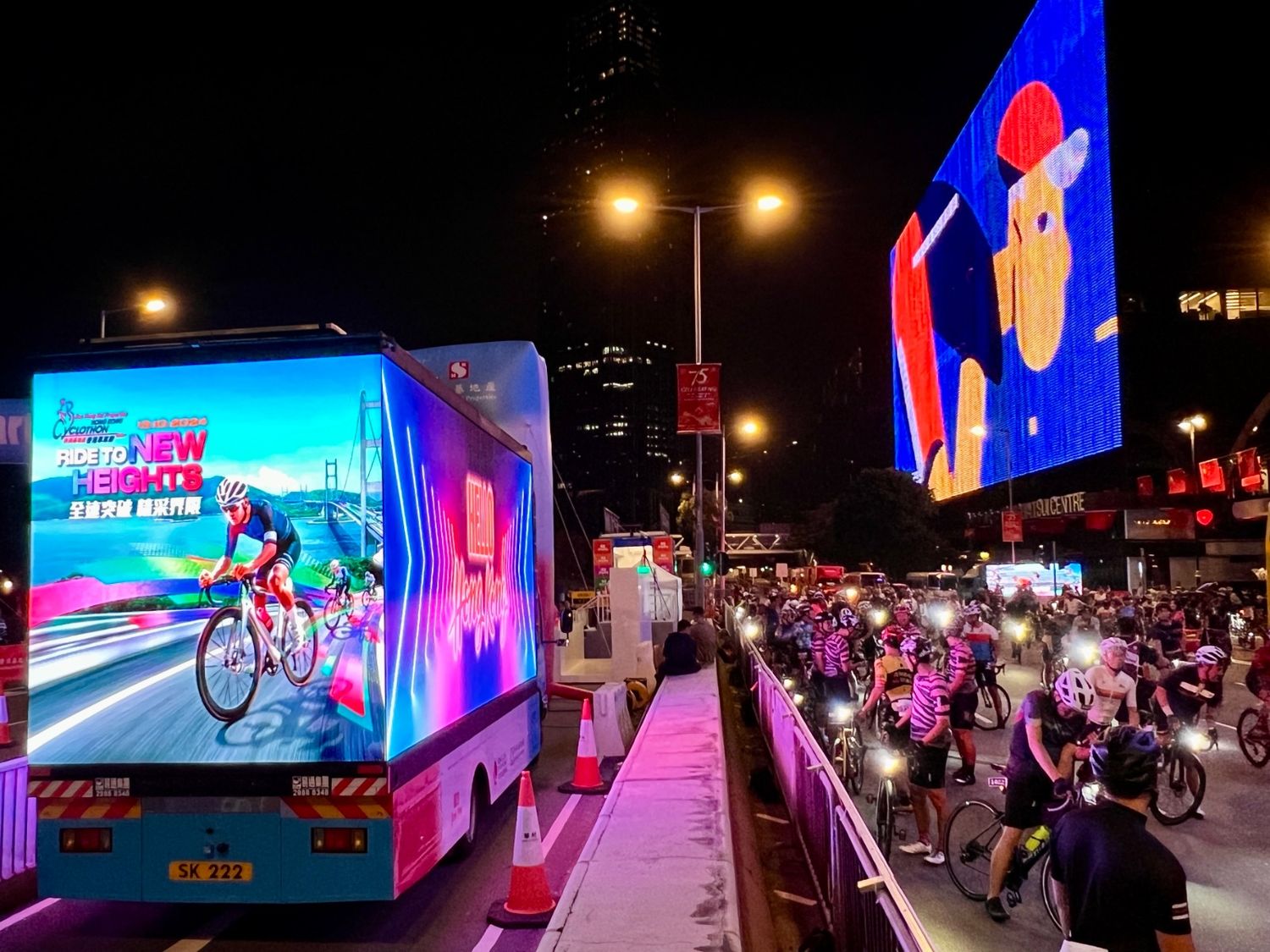 The Prism lit up on a Hong Kong street at night